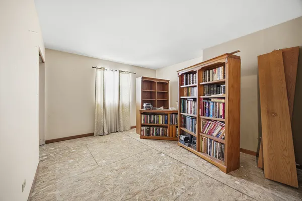 a view of empty room with furniture