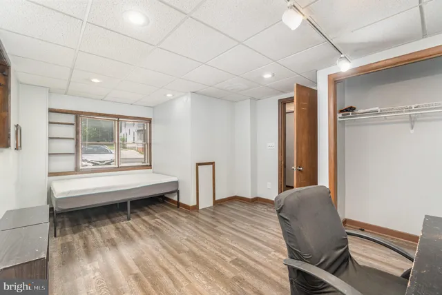 a view of a livingroom with furniture and a workspace