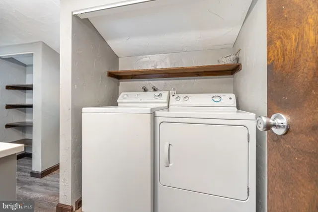 a bedroom with a rug and a window