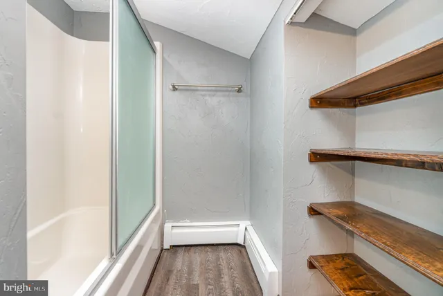 a picture of a bench in front of a door