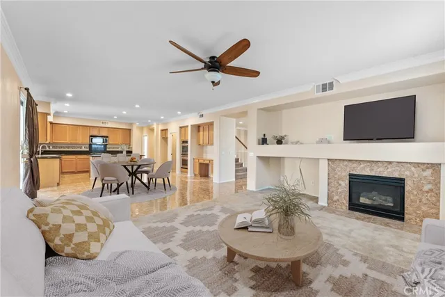 a kitchen with granite countertop stainless steel appliances a stove a microwave a sink and cabinets