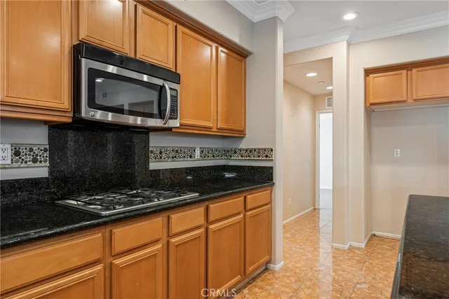 an empty room with closet and a ceiling fan