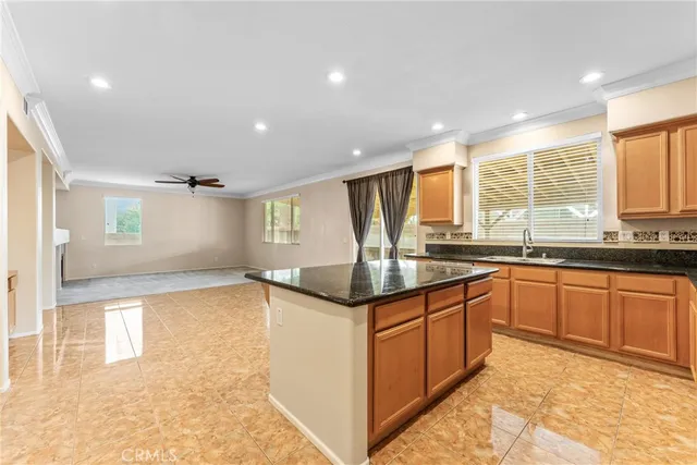 a view of kitchen with stainless steel appliances cabinets and outdoor kitchen view