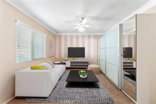 an empty room with a window and a ceiling fan