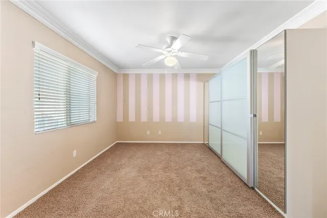 a spacious bedroom with a large bed and a couch