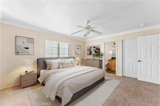 an empty room with windows and ceiling fan