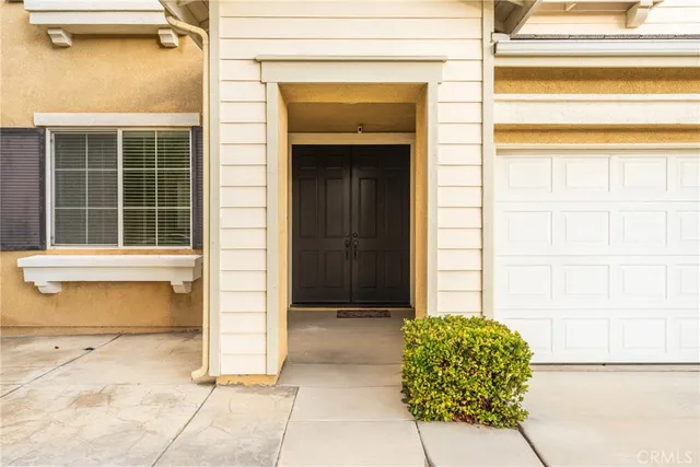 a front view of a house with a shower and a window