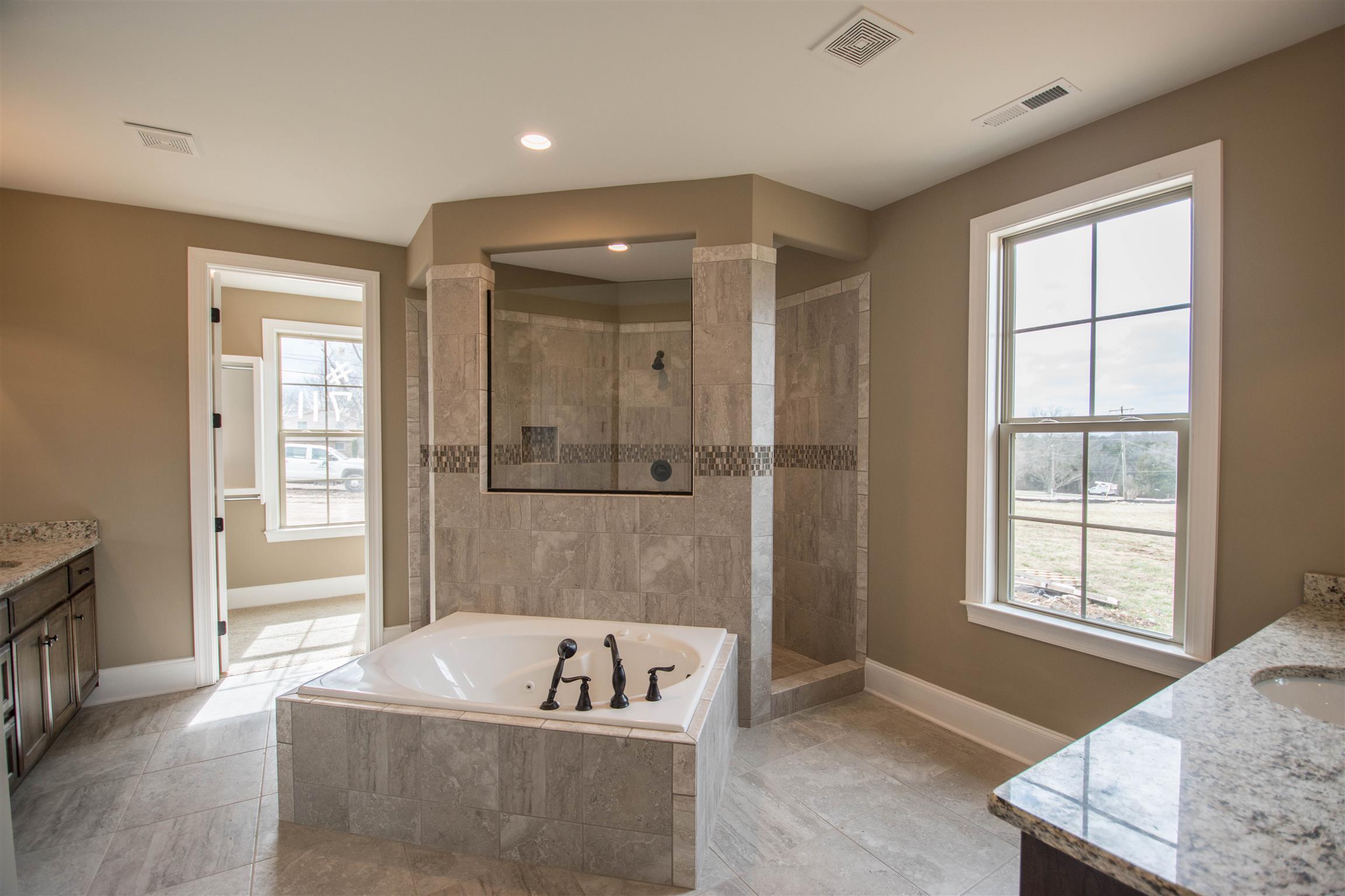 1345 Center Point Road Hendersonville, TN 37075 - Photo 25 of 27 a spacious bathroom with a tub a sink and a window