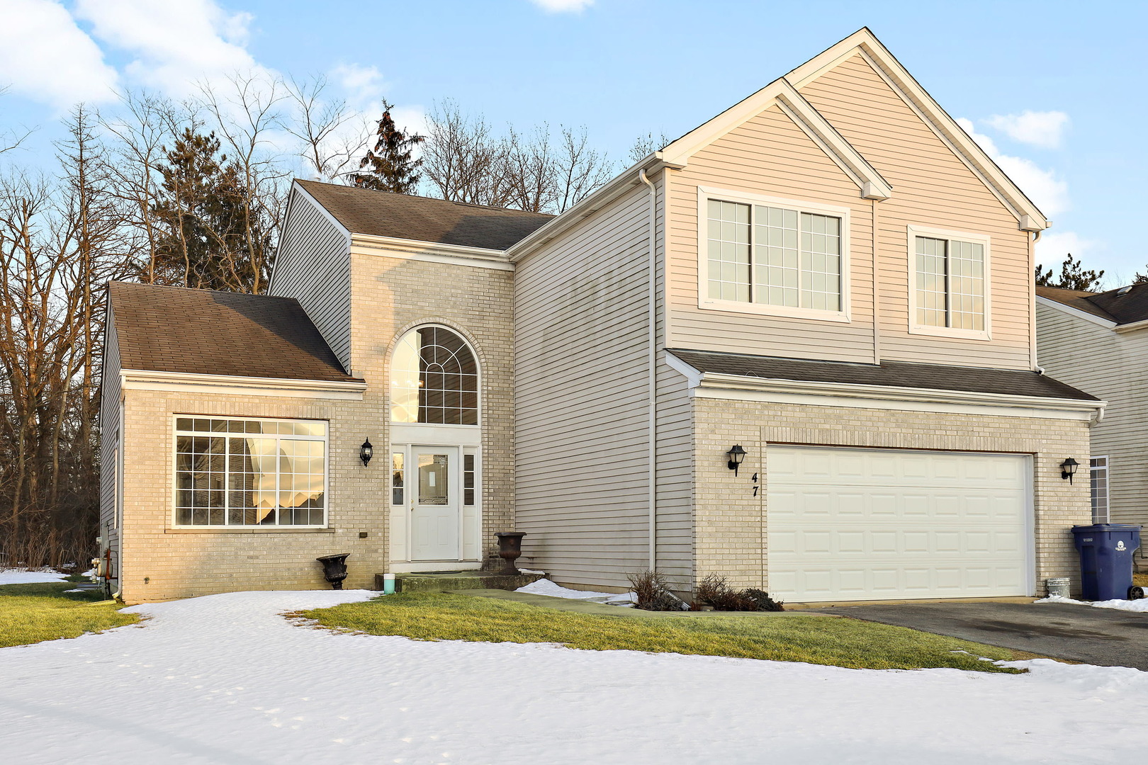 47 Sundance Road Matteson, IL 60443 - Photo 1 of 1 a front view of a house with a yard and garage