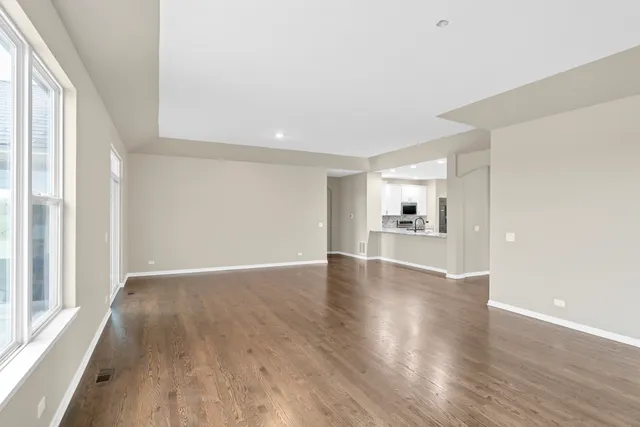 a room with furniture a flat screen tv and a fireplace