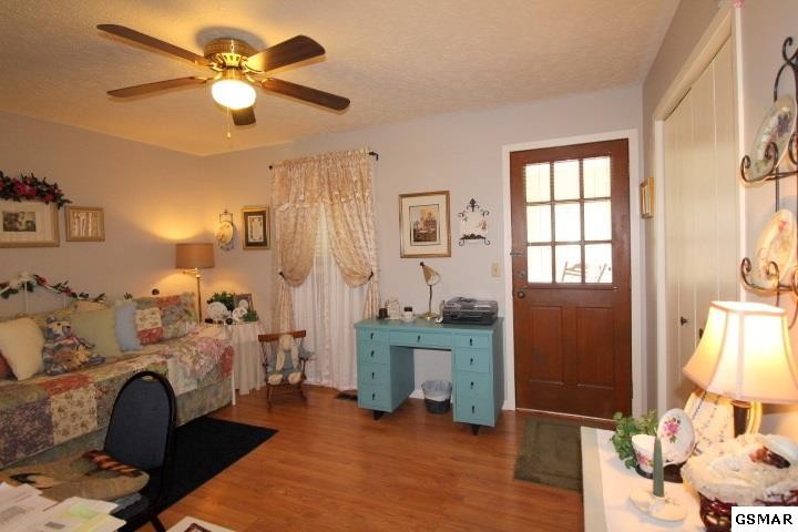 1822 New Era Road Sevierville, TN 37862 - Photo 15 of 34 a bedroom with furniture and a chandelier fan