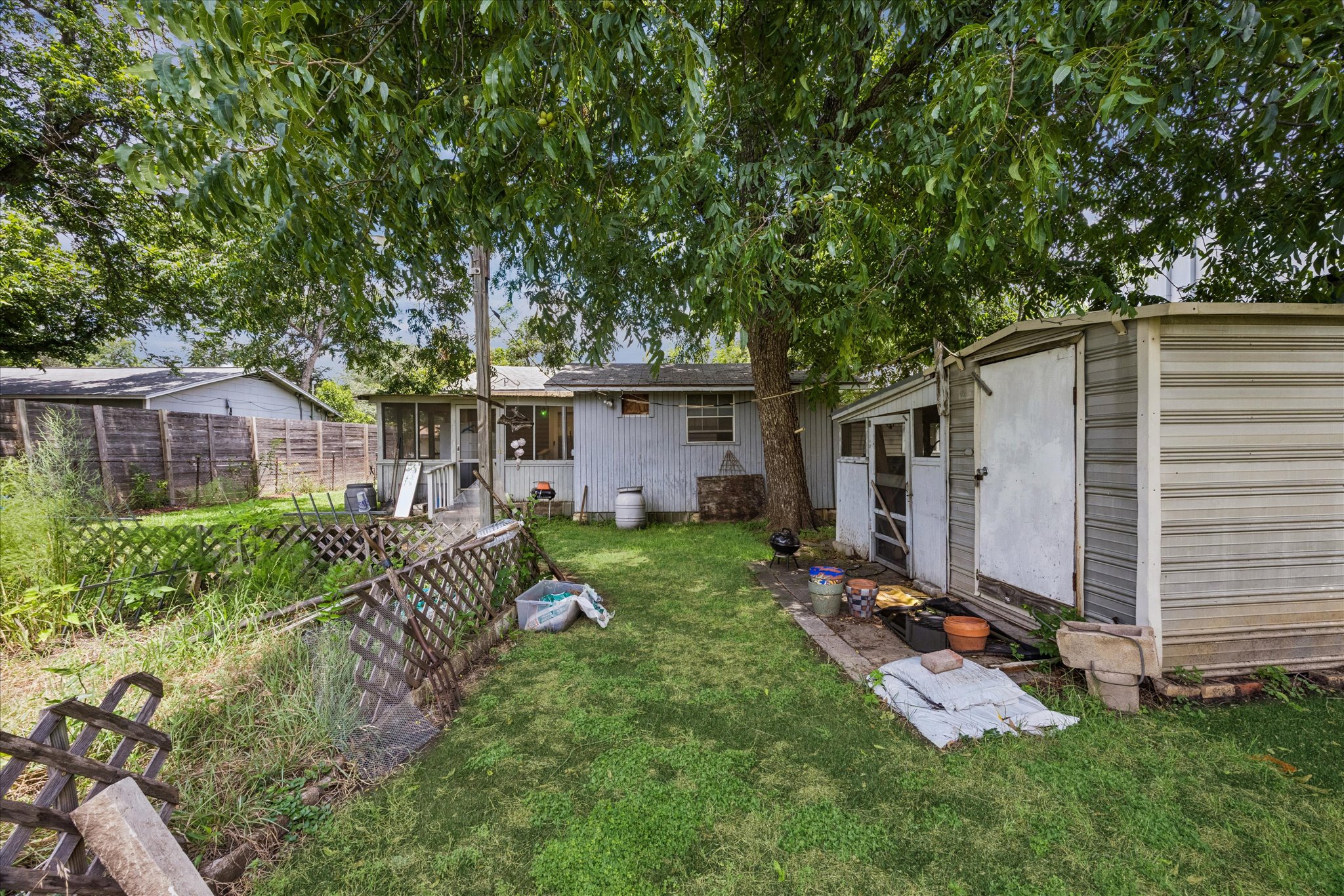 2009 Fort View Road Austin, TX 78704 - Photo 39 of 40 A well-maintained lawn and sturdy privacy fence define this tranquil backyard space.
