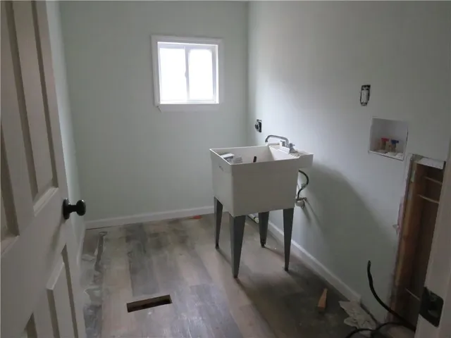 a bathroom with a granite countertop toilet a sink and a bathtub