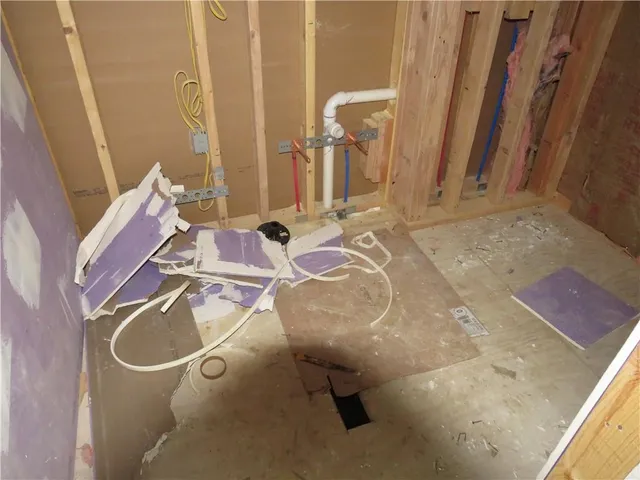 a view of storage and utility room with window