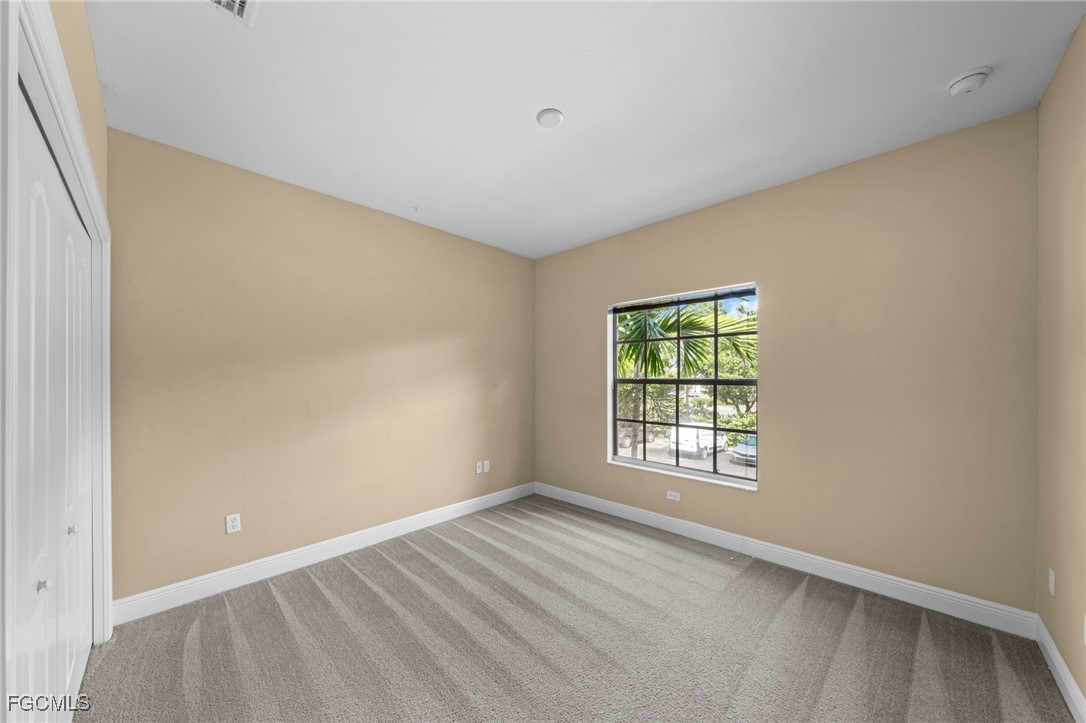 4110 Castilla Circle, Unit 104 Fort Myers, FL 33916 - Photo 13 of 37 a view of an empty room with a window