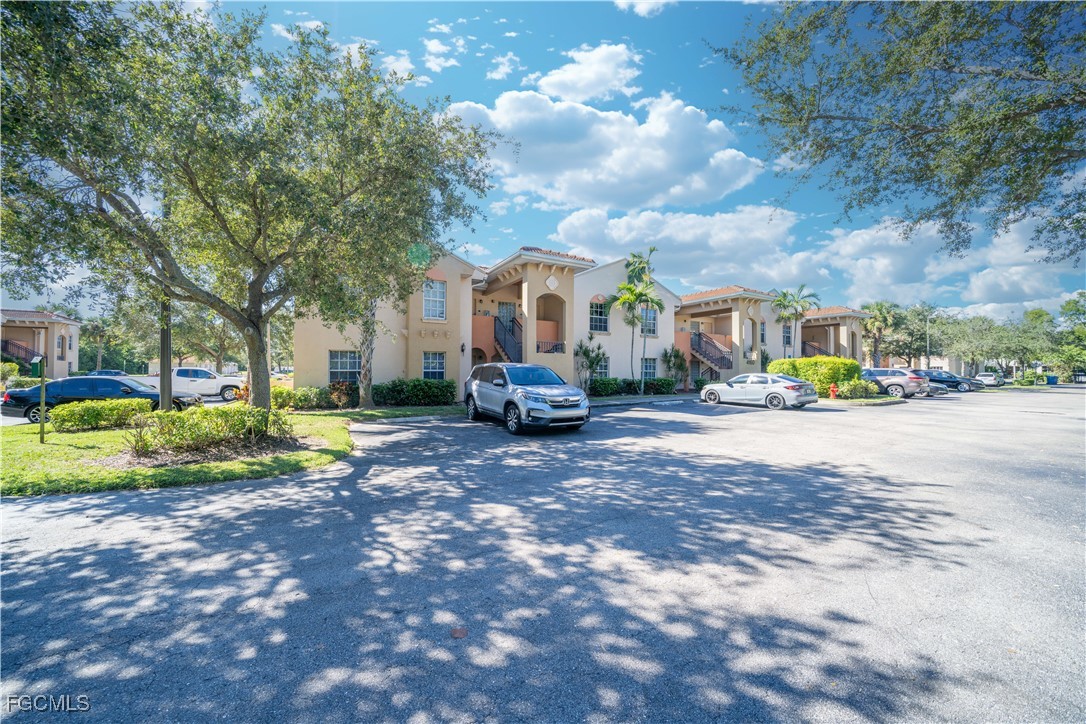 4110 Castilla Circle, Unit 104 Fort Myers, FL 33916 - Photo 24 of 37 a view of road with card parked