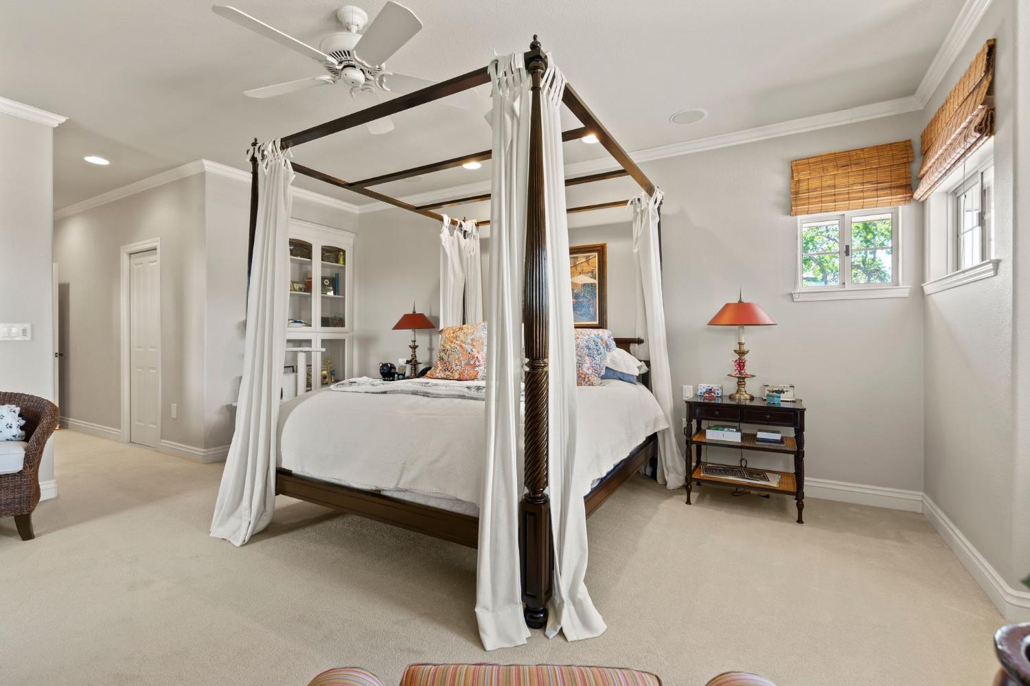10676 Wilton Road Elk Grove, CA 95624 - Photo 63 of 71 a bed room with a bed and a chandelier
