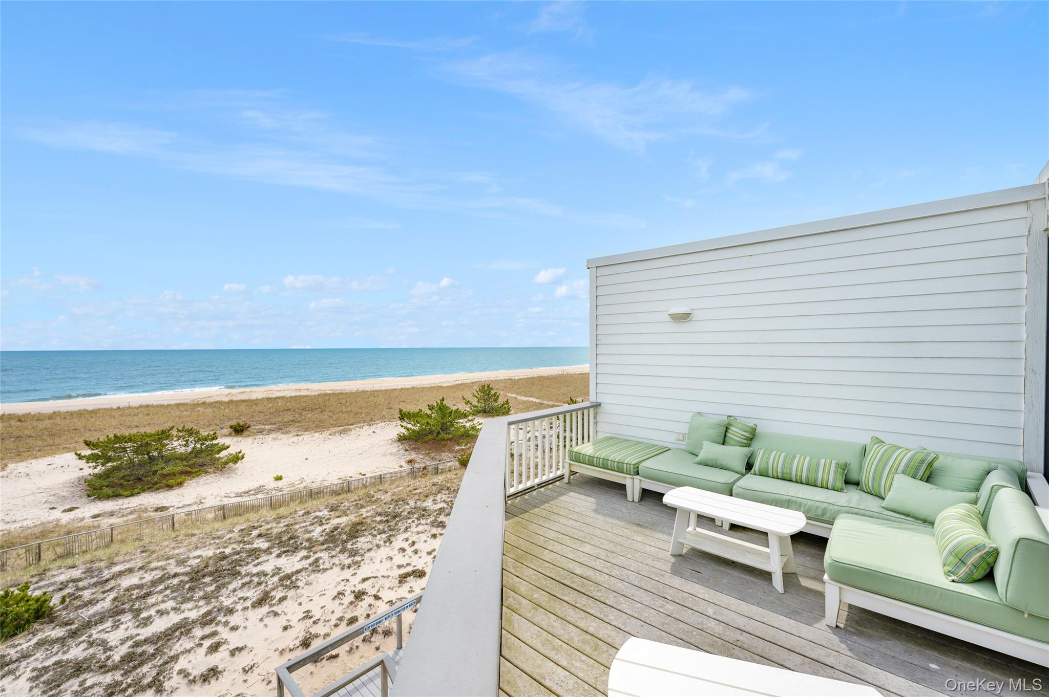 265 Dune Road, Unit 68 Westhampton Beach, NY 11978 - Photo 14 of 25 a view of a terrace with wooden floor and pool table