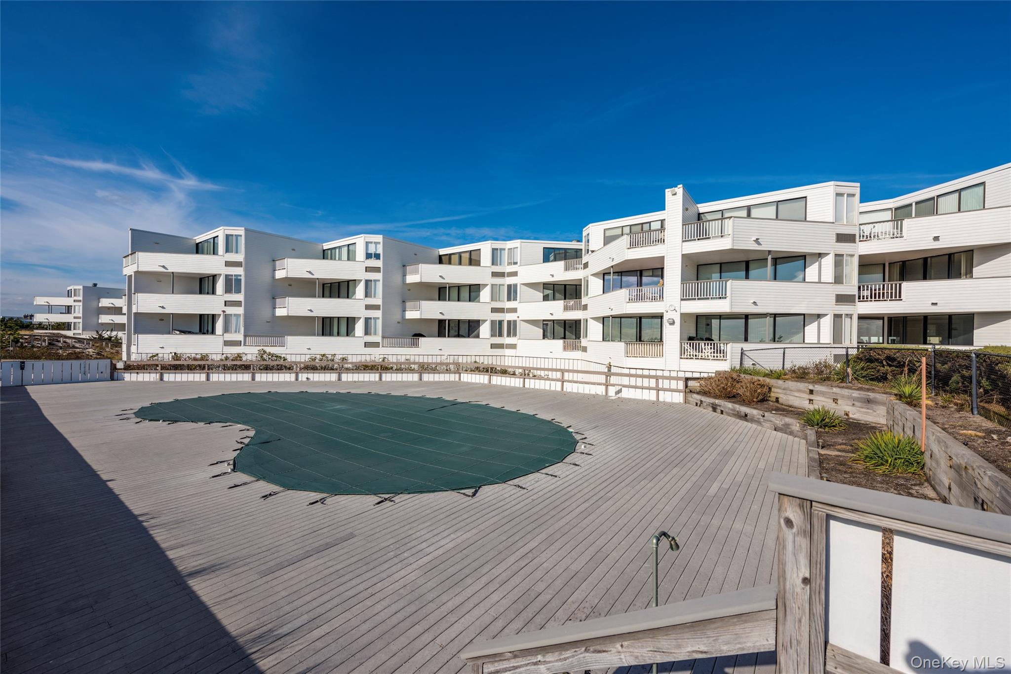 265 Dune Road, Unit 68 Westhampton Beach, NY 11978 - Photo 21 of 25 a building view with outdoor space