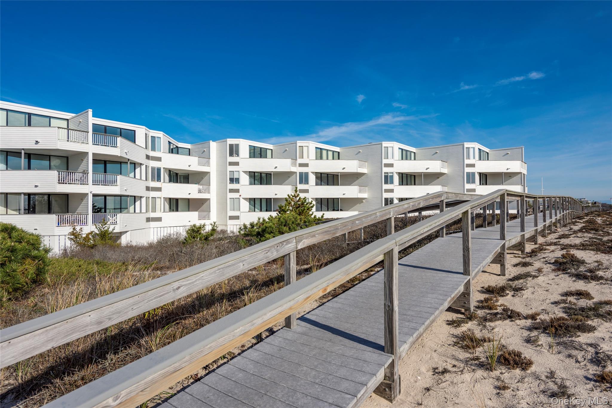 265 Dune Road, Unit 68 Westhampton Beach, NY 11978 - Photo 22 of 25 a city view from a balcony