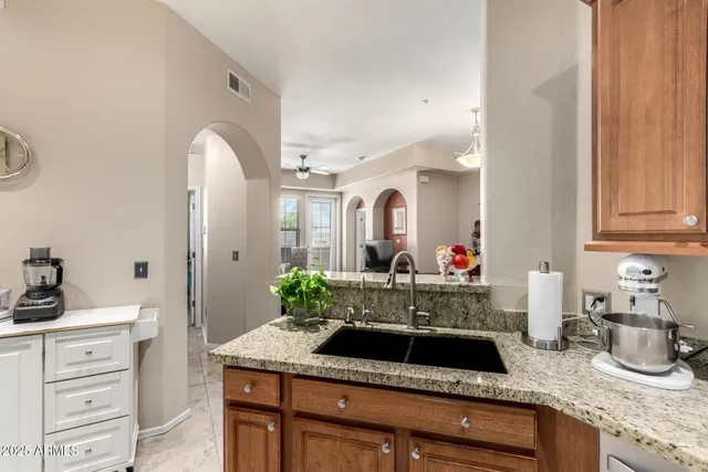 a room with sink and mirror