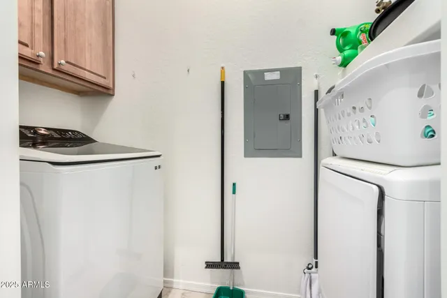 a kitchen with a refrigerator and cabinets