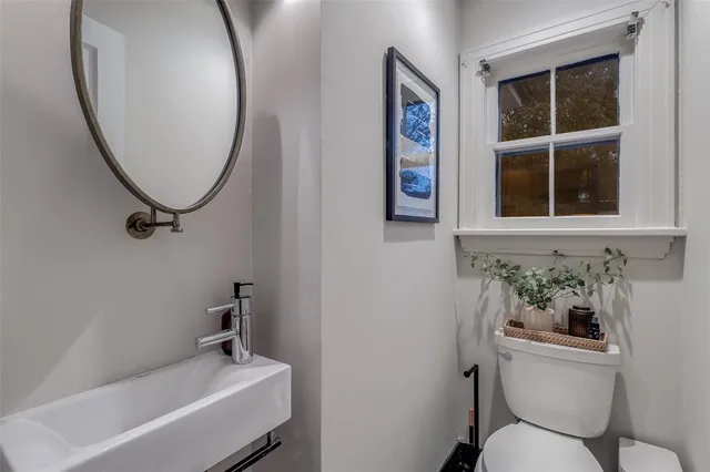 a bathroom with a toilet and a sink
