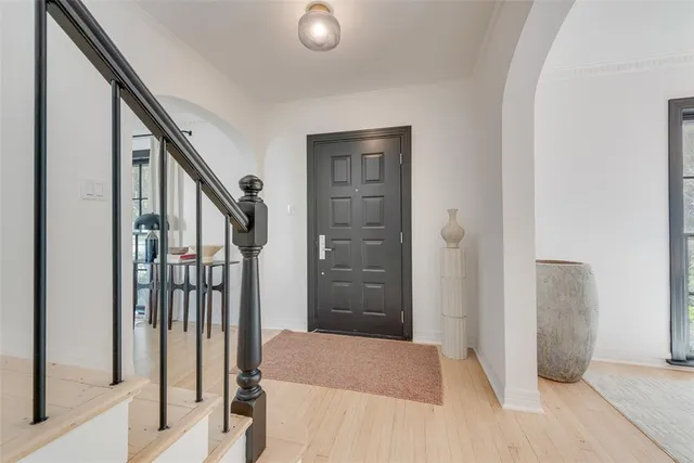 a bedroom with a bed and a mirror