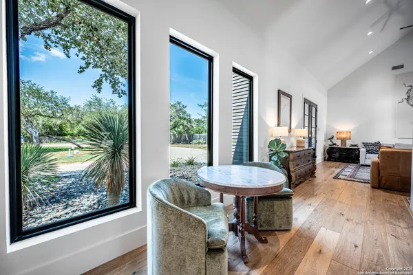 a view of a dining room with furniture window and wooden floor