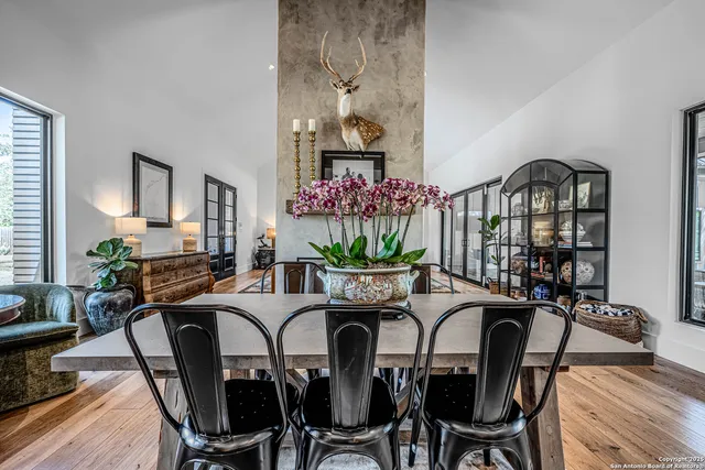 a view of a dining room with furniture and a potted plant