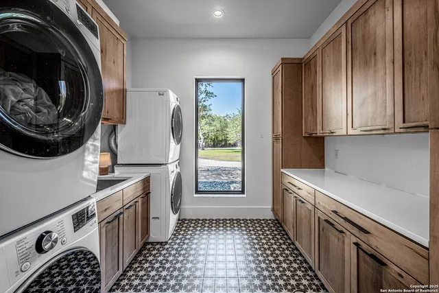 a kitchen with stainless steel appliances a stove a microwave and a cabinets