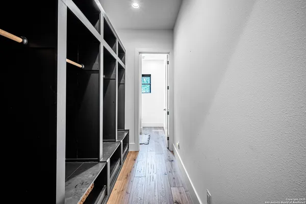 a view of hallway with wooden floor
