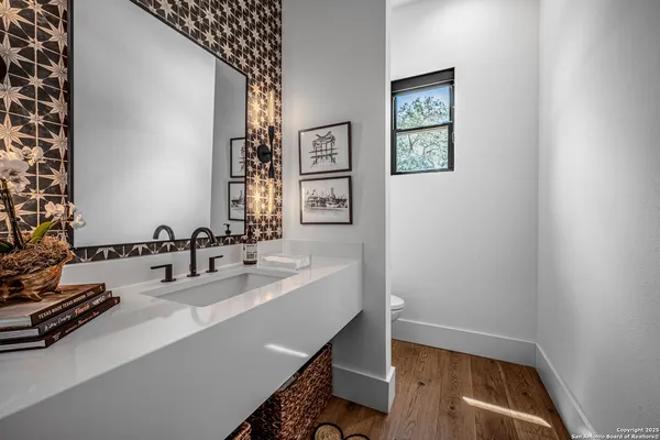 a bathroom with a sink and a mirror