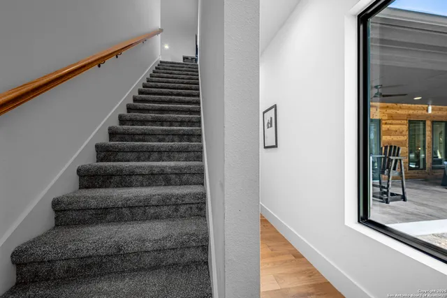 a view of entryway and hall with wooden floor