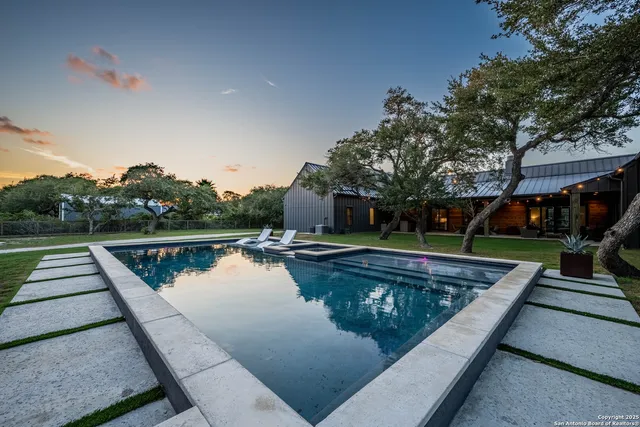 a view of swimming pool with lounge chair