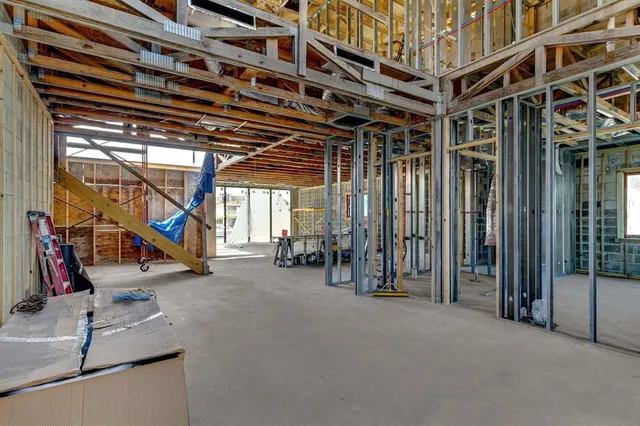 a view of a patio with a table and chairs