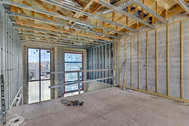 a view of a room with large windows