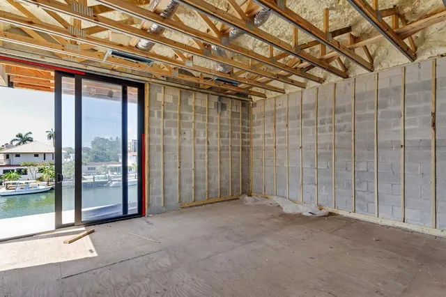 a view of a room with large windows