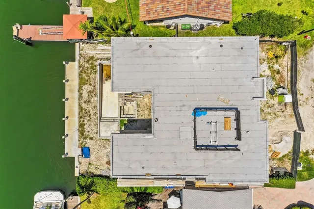 an aerial view of a house with outdoor space