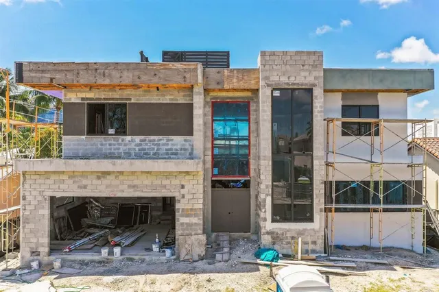 a view of a patio with table and chairs and potted plants