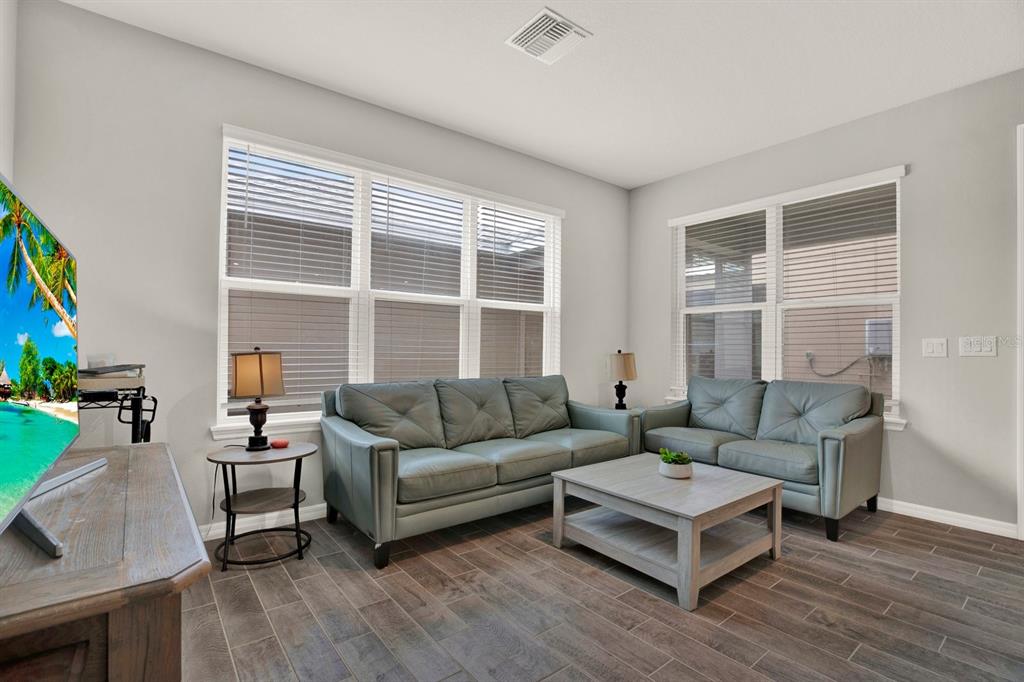 13729 Rangeland Boulevard Odessa, FL 33556 - Photo 7 of 30 a living room with furniture and a window