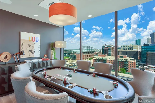 a living room with furniture and a floor to ceiling window