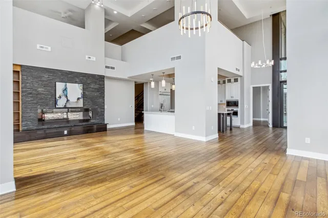 a view of an empty room with glass door and glass door