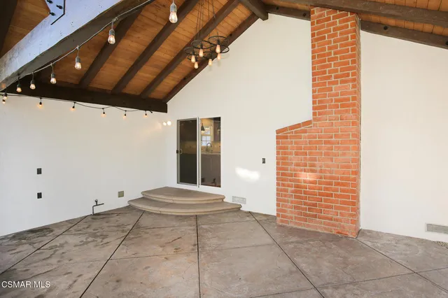 a view of outdoor space with stairs and a window