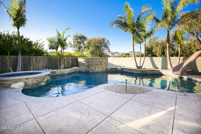 a view of a swimming pool with a patio