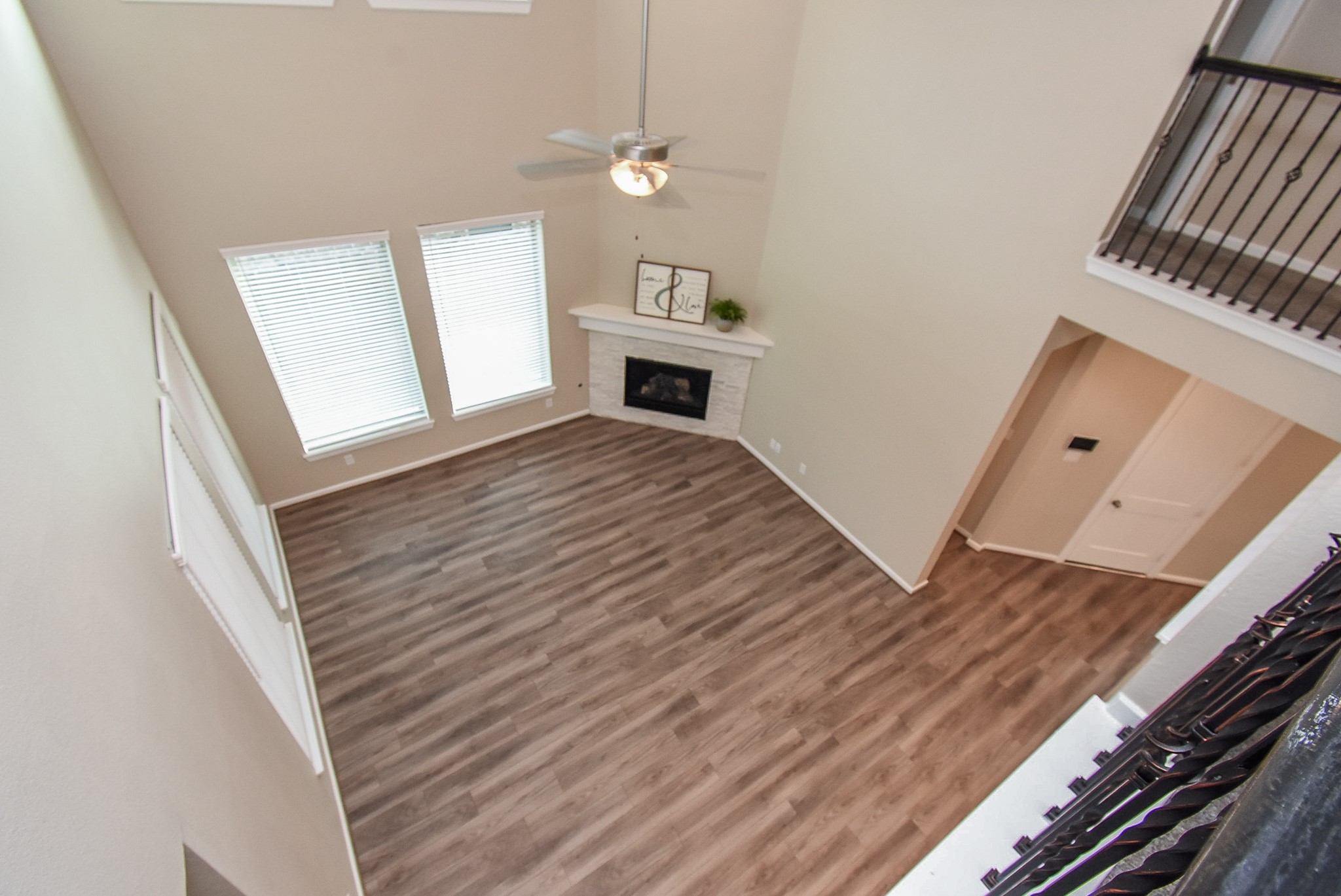 7322 Perching Hawk Trail Katy, TX 77493 - Photo 19 of 38 a view of a livingroom with wooden floor and staircase