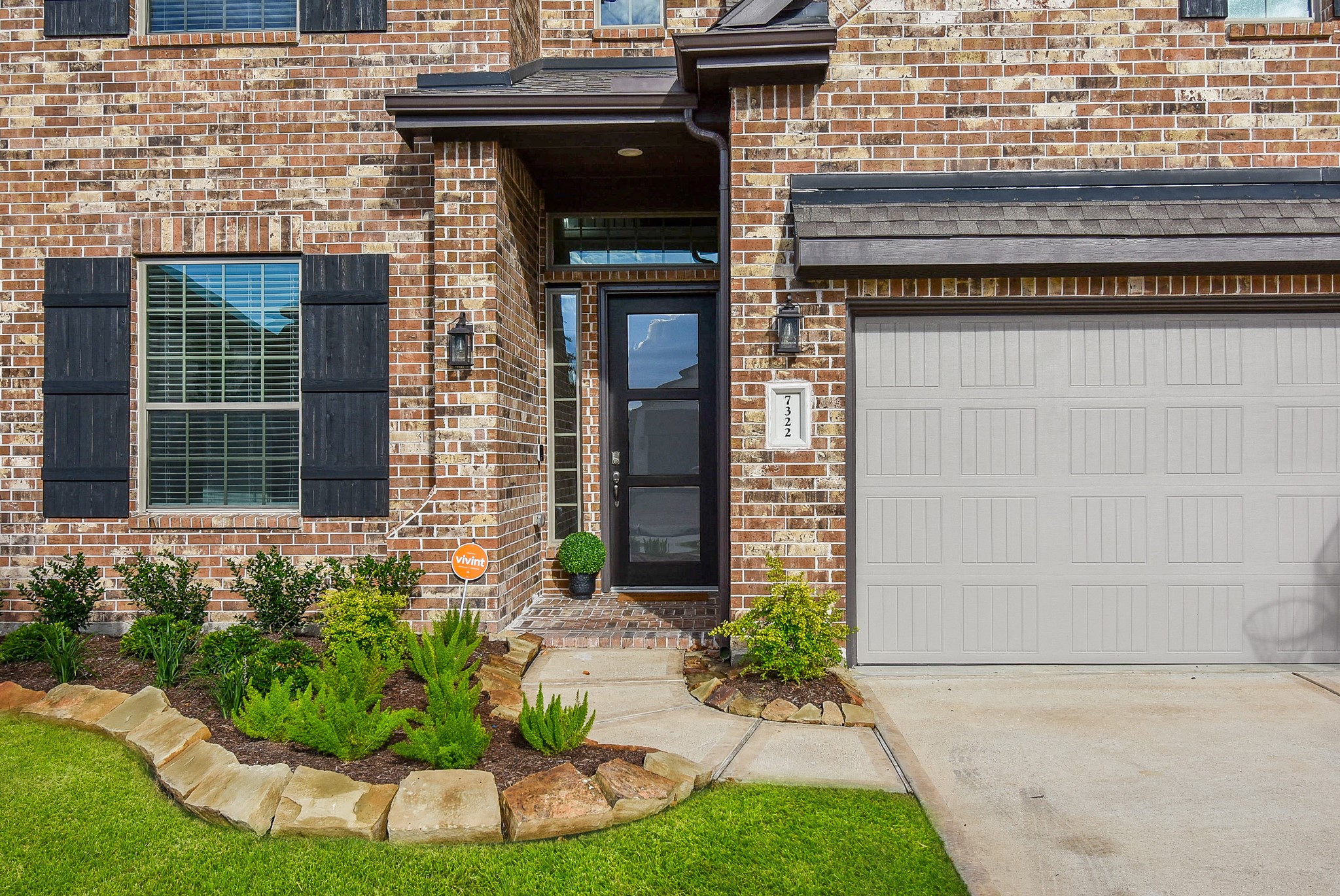 7322 Perching Hawk Trail Katy, TX 77493 - Photo 2 of 38 a front view of a house having yard