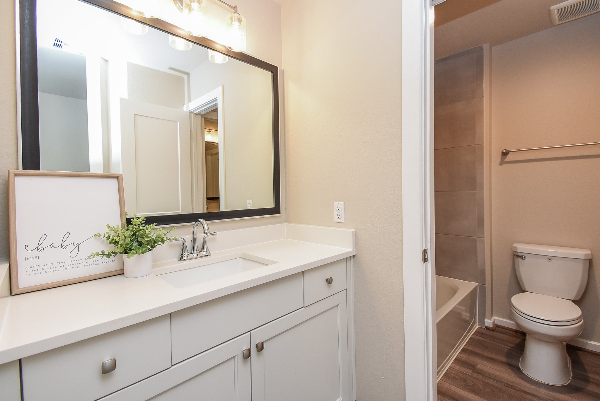 7322 Perching Hawk Trail Katy, TX 77493 - Photo 27 of 38 a bathroom with a sink a toilet and a large mirror