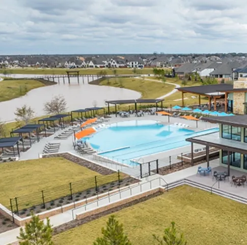 a view of yard with swimming pool and green space