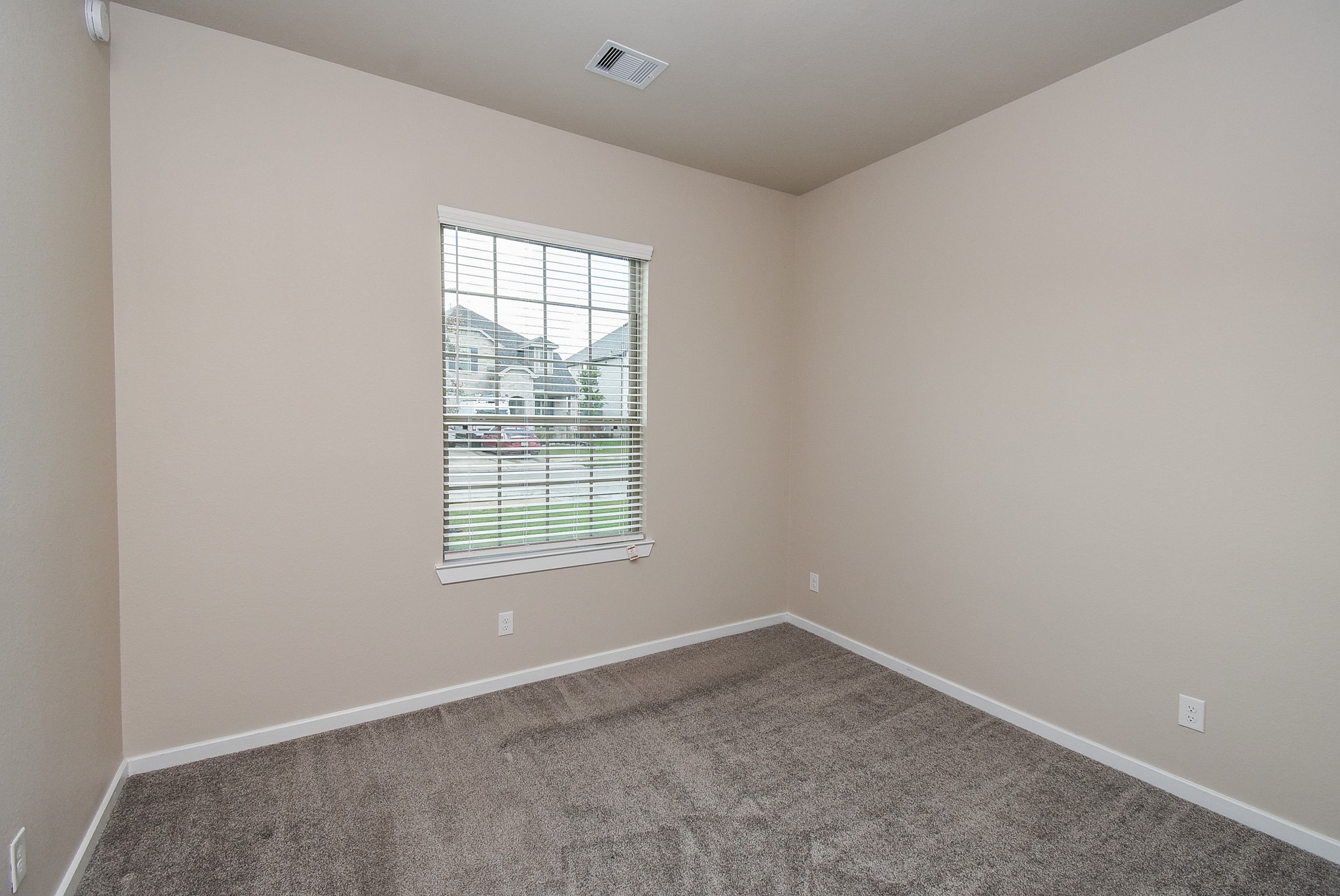 7322 Perching Hawk Trail Katy, TX 77493 - Photo 4 of 38 an empty room with a window